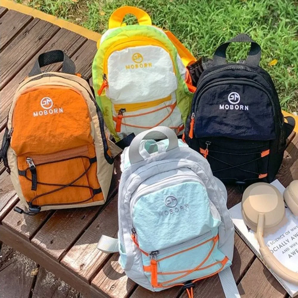 Корейский стиль, уличный рюкзак на шнурке, однотонный спортивный дорожный нейлоновый рюкзак, водонепроницаемая походная сумка на плечо для женщин
Корейский стиль, уличный рюкзак на шнурке, однотонный спортивный дорожный нейлоновый рюкзак, водонепроницаемая походная сумка на плечо для женщин