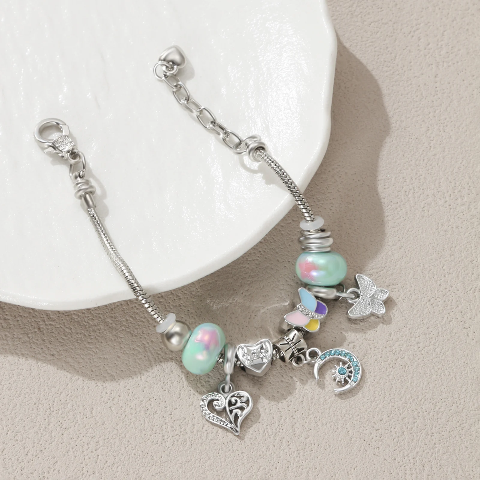 Silver Tone Charm Bracelet with Pastel Butterfly and Moon Pendant for Women
Silver Tone Charm Bracelet with Pastel Butterfly and Moon Pendant for Women