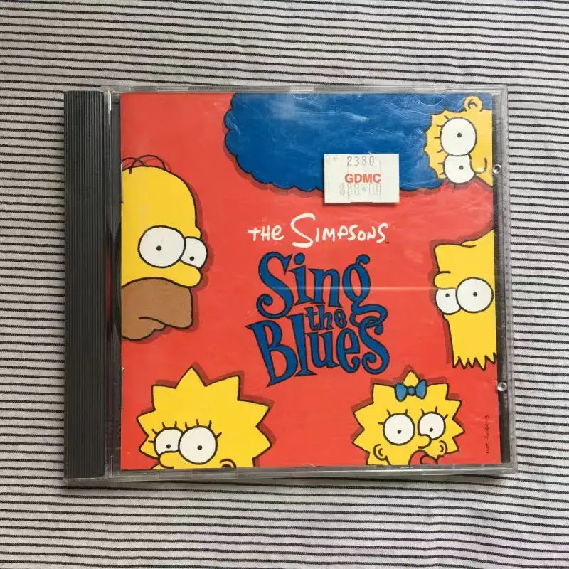 CD The Simpsons – The Simpsons Sing The Blues, CD Geffen Records P 1970 года, 10 треков, комедия/поп/бюль, рекламное издание
CD The Simpsons – The Simpsons Sing The Blues, CD Geffen Records P 1970 года, 10 треков, комедия/поп/бюль, рекламное издание