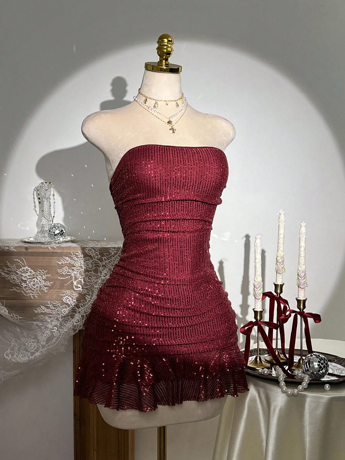Burgundy Sequin Strapless Ruched Mini Dress with Flared Hem
Burgundy Sequin Strapless Ruched Mini Dress with Flared Hem