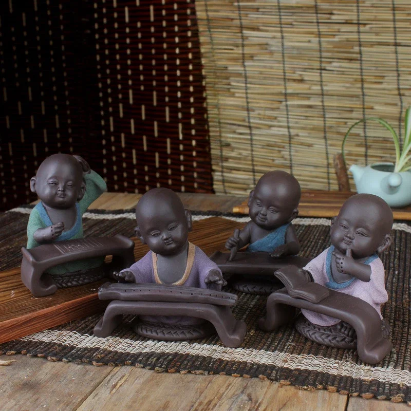 Colored sand pottery qin chess calligraphy and painting little monk purple sand tea pet creative gift
Colored sand pottery qin chess calligraphy and painting little monk purple sand tea pet creative gift