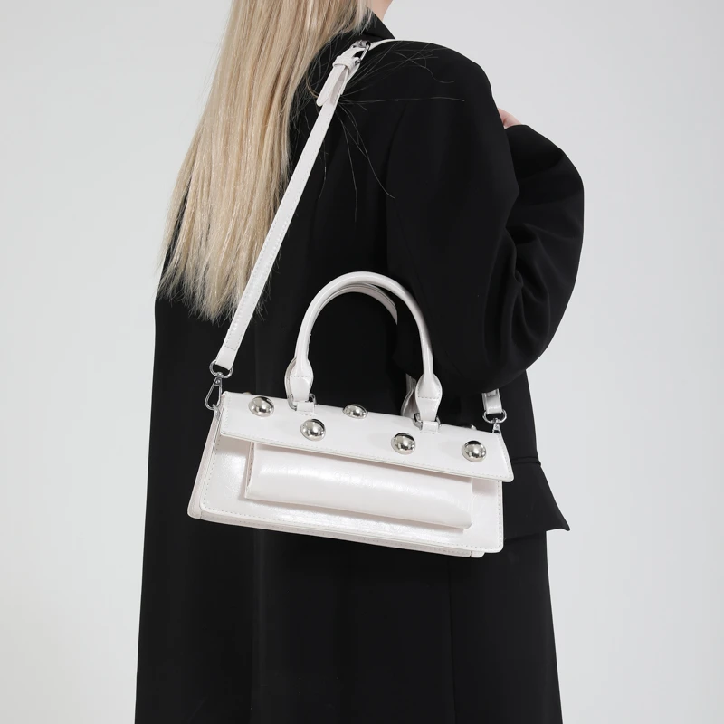 Korean Version Pure Color Pu Leather Rivet Personalized Handheld Shoulder Cross Arm Tote Bag for Women
Korean Version Pure Color Pu Leather Rivet Personalized Handheld Shoulder Cross Arm Tote Bag for Women