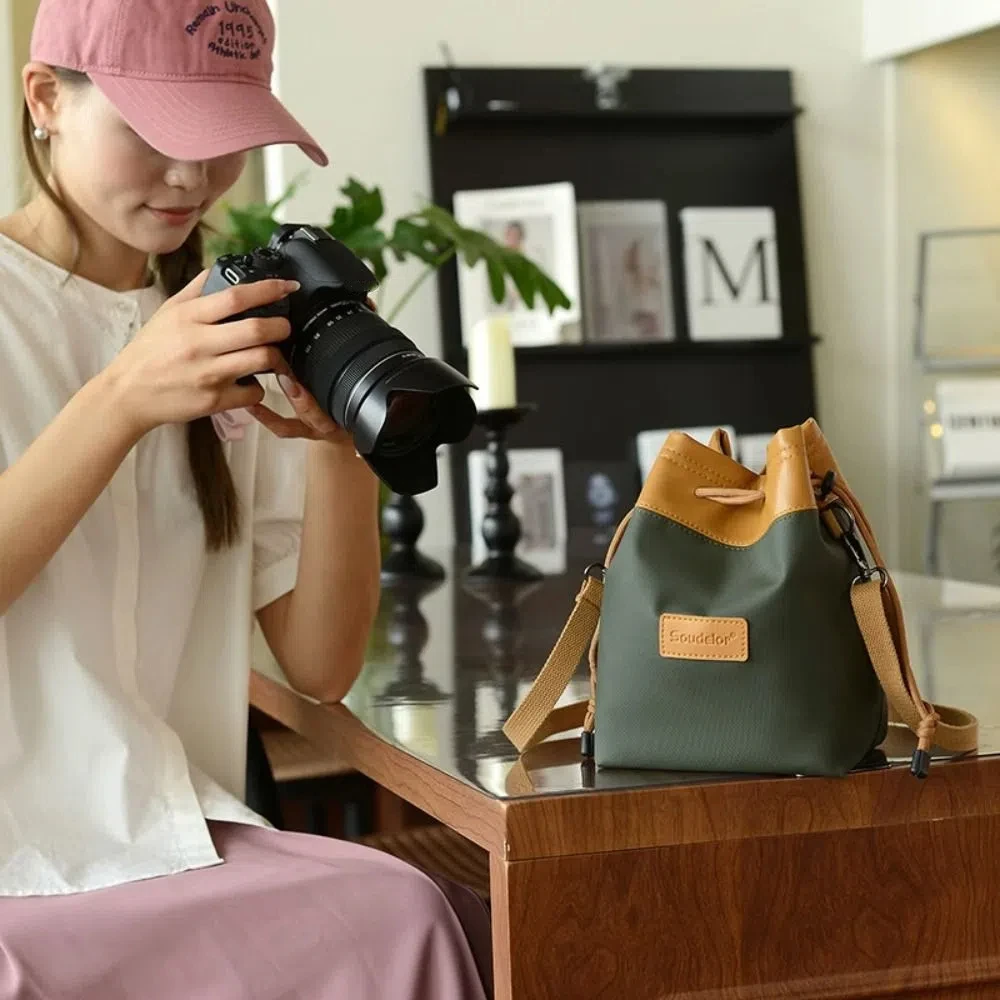 Износостойкая сумка через плечо для хранения камеры с 3 вставными карманами, пылезащитная сумка на шнурке для зеркальной фотокамеры, портативный регулируемый ремень
Износостойкая сумка через плечо для хранения камеры с 3 вставными карманами, пылезащитная сумка на шнурке для зеркальной фотокамеры, портативный регулируемый ремень