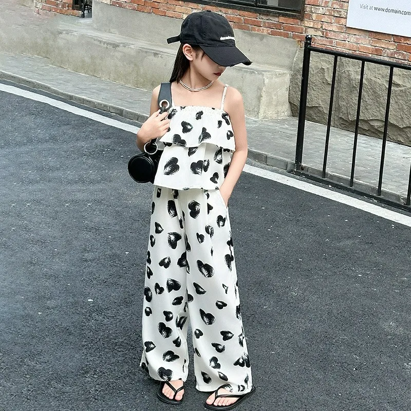 Girl's Ice Silk Set 2024 Summer New Korean Edition Fashionable Children's Summer Sling Wide Leg Pants Two Piece Set
Girl's Ice Silk Set 2024 Summer New Korean Edition Fashionable Children's Summer Sling Wide Leg Pants Two Piece Set