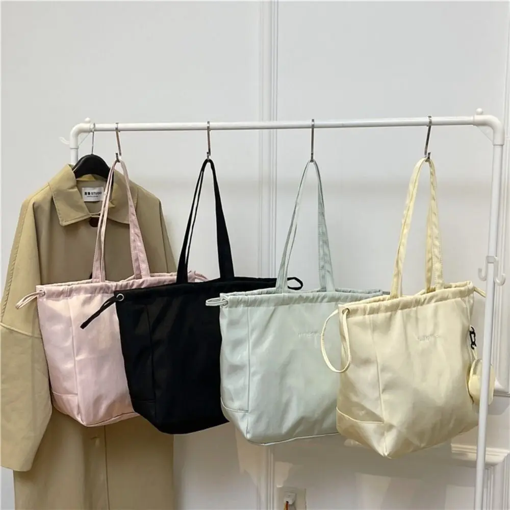 Korean Style Drawstring Tote Bag Lightweight Nylon Large Capacity Tote Bag Waterproof Casual Women's Shoulder Bag Ladies/Girls
Korean Style Drawstring Tote Bag Lightweight Nylon Large Capacity Tote Bag Waterproof Casual Women's Shoulder Bag Ladies/Girls
