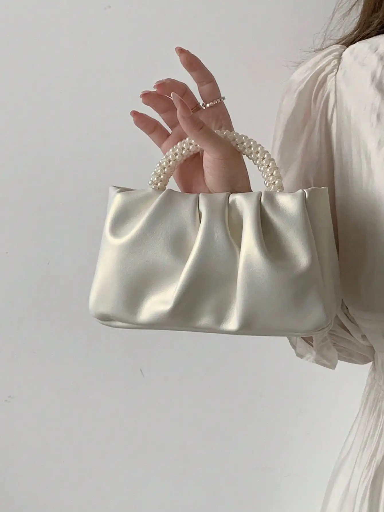 Cream Satin Ruched Top Handle Bag with Pearl Beaded Handle
Cream Satin Ruched Top Handle Bag with Pearl Beaded Handle