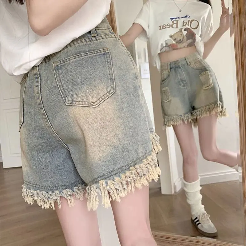 Vintage Stylish Ripped Tassel Spliced Denim Shorts Female Clothing Distressed Summer High Waist Button American Wide Leg Shorts
Vintage Stylish Ripped Tassel Spliced Denim Shorts Female Clothing Distressed Summer High Waist Button American Wide Leg Shorts