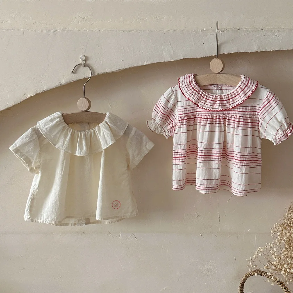 2026 Summer New Girls Short Sleeve Shirts Cotton Infant Simple Blouse Baby Girl Sweet Ruffle Collar Tops Toddler Clothes
2026 Summer New Girls Short Sleeve Shirts Cotton Infant Simple Blouse Baby Girl Sweet Ruffle Collar Tops Toddler Clothes