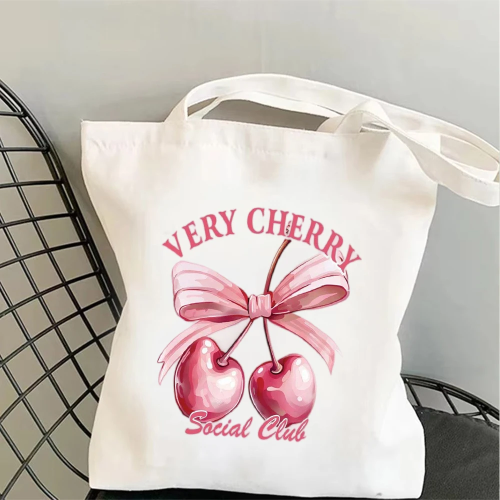 Stylish Coquette Cherry Print Canvas Tote Bag, Shoulder Bag, Cute Bow & Slogan Design Bag for School Work & Casual Outings
Stylish Coquette Cherry Print Canvas Tote Bag, Shoulder Bag, Cute Bow & Slogan Design Bag for School Work & Casual Outings