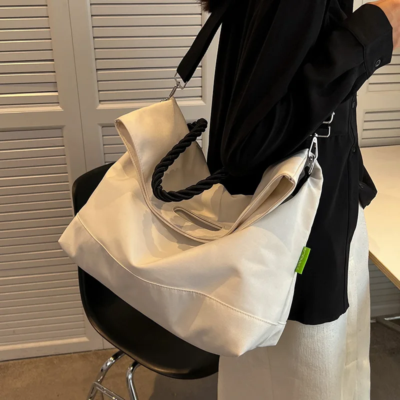 Large Capacity White Tote Bag Women's New College Student Class Canvas Shoulder Nylon Cloth Handheld Commuter Tote Bag
Large Capacity White Tote Bag Women's New College Student Class Canvas Shoulder Nylon Cloth Handheld Commuter Tote Bag
