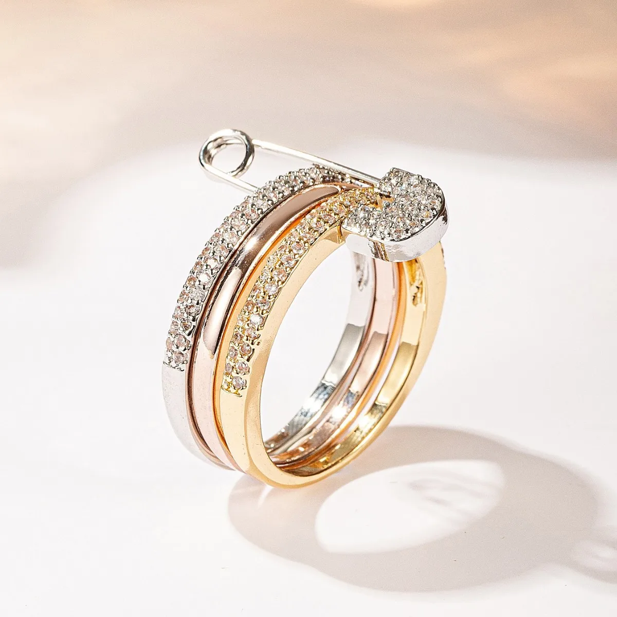 Safety Pin Shape Triple Band Ring, CZ Paved Three Tone Stackable Ring for Women
Safety Pin Shape Triple Band Ring, CZ Paved Three Tone Stackable Ring for Women