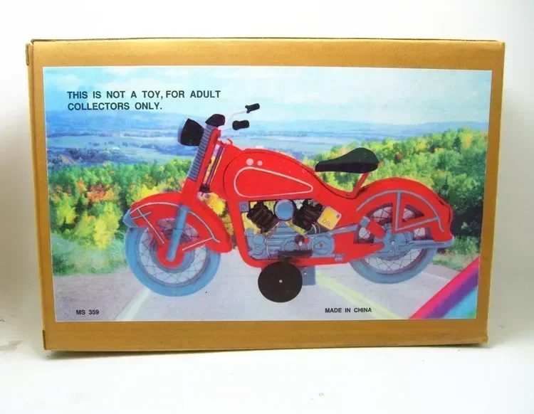 Retro wind-up metal tin toy featuring vintage motorcycle mechanical clockwork figure makes excellent kids gift
Retro wind-up metal tin toy featuring vintage motorcycle mechanical clockwork figure makes excellent kids gift