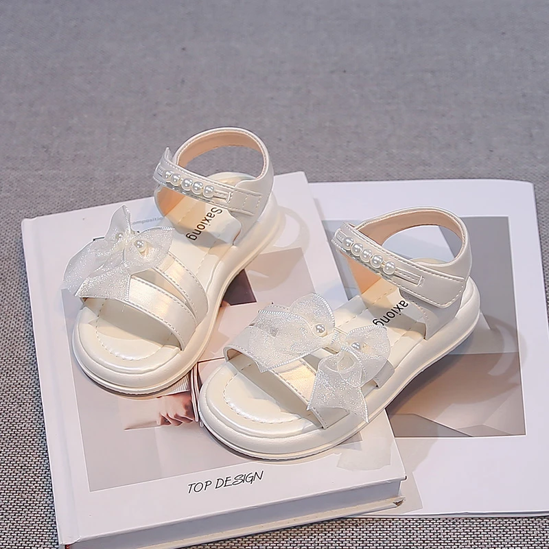 Kids Sandals Korean Style Versatile Girls Casual Shoes Soild Color Soft Sole 2026 Summer New Children Beach Shoes Sweet Lace Bow
Kids Sandals Korean Style Versatile Girls Casual Shoes Soild Color Soft Sole 2026 Summer New Children Beach Shoes Sweet Lace Bow