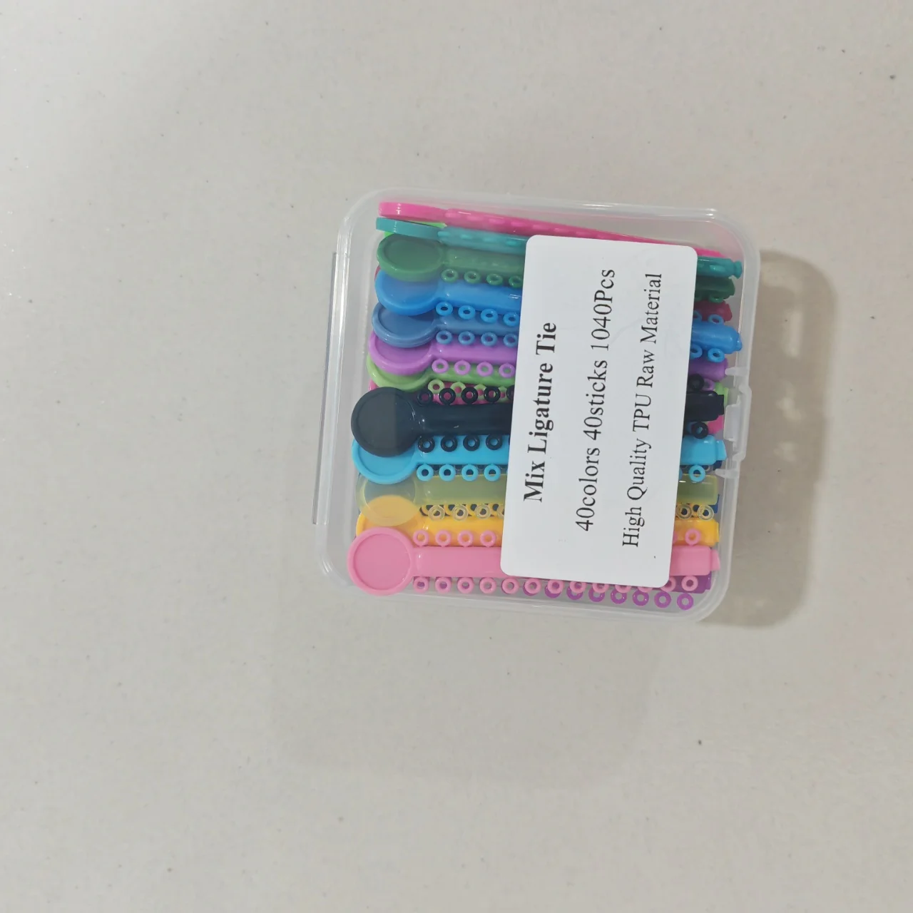 1Box 40sticks 1040PCS High Quality TPU Raw Material Dental Ligature Tie Mixing Color
1Box 40sticks 1040PCS High Quality TPU Raw Material Dental Ligature Tie Mixing Color