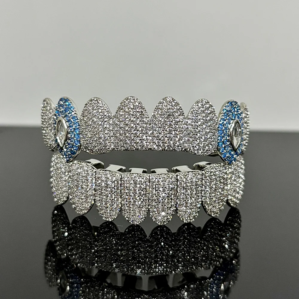 RACHELZ Hip Hop Blue Eye Zircon Tooth Caps Brace Punk Full CZ Stone Teeth Grillz For Women Men Jewelry Top Bottom Dental Grills
RACHELZ Hip Hop Blue Eye Zircon Tooth Caps Brace Punk Full CZ Stone Teeth Grillz For Women Men Jewelry Top Bottom Dental Grills