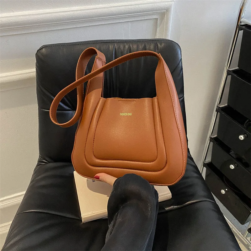 Минималистичная сумка-ведро 2025 года, городская стильная сумка через плечо для женщин, большая вместительная сумка через плечо, модная осенне-зимняя сумка 
Минималистичная сумка-ведро 2025 года, городская стильная сумка через плечо для женщин, большая вместительная сумка через плечо, модная осенне-зимняя сумка