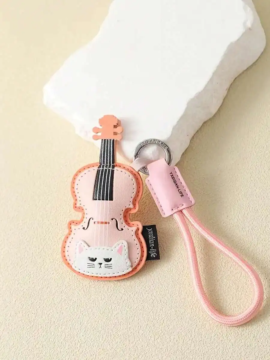 Cute cat-shaped musical instrument keychain in PU leather featuring violin piano guitar designs perfect for bags backpacks cars
Cute cat-shaped musical instrument keychain in PU leather featuring violin piano guitar designs perfect for bags backpacks cars
