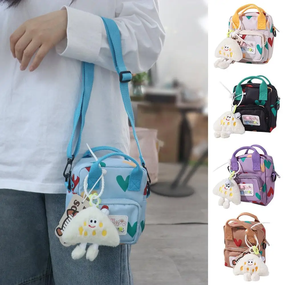 Сумка через плечо в корейском стиле с мультяшным рисунком и подвеской, мини-сумка с допамином, модная детская сумка-мессенджер с принтом в виде сердца любви
Сумка через плечо в корейском стиле с мультяшным рисунком и подвеской, мини-сумка с допамином, модная детская сумка-мессенджер с принтом в виде сердца любви