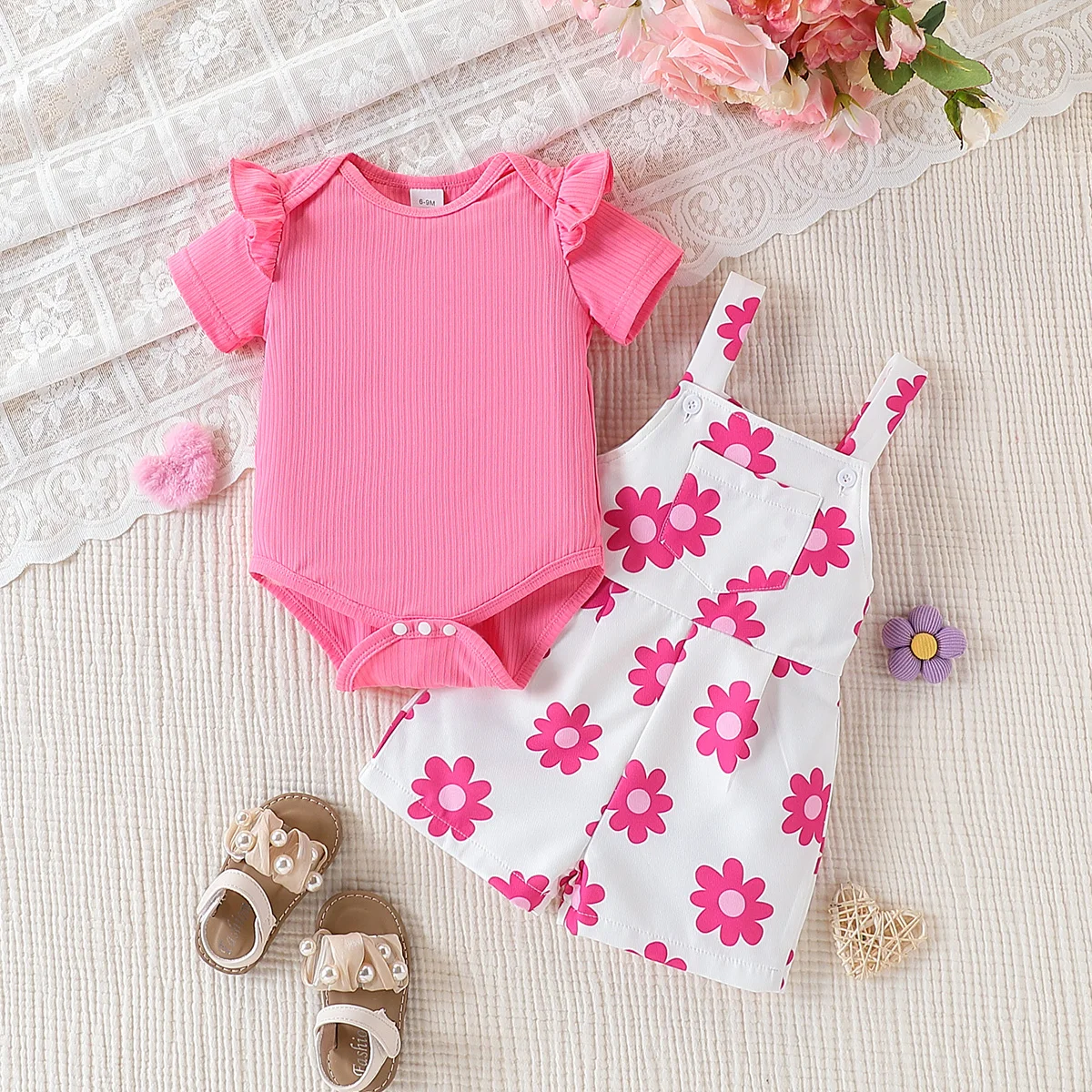 2-piece set of cute and sweet round neck short sleeved jumpsuit and floral printed shoulder shorts for baby girls, summer
2-piece set of cute and sweet round neck short sleeved jumpsuit and floral printed shoulder shorts for baby girls, summer