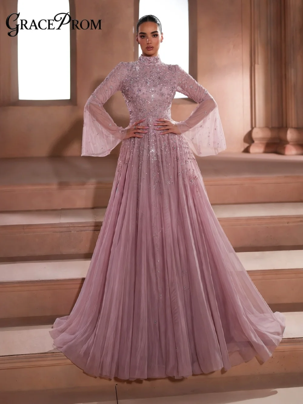 Stunning Dusty Pink High Neck Long Sleeve Beaded Party Dress Tulle Evening Gown 2026 Airy A Line For Wedding Guests فساتين سهرة
Stunning Dusty Pink High Neck Long Sleeve Beaded Party Dress Tulle Evening Gown 2026 Airy A Line For Wedding Guests فساتين سهرة