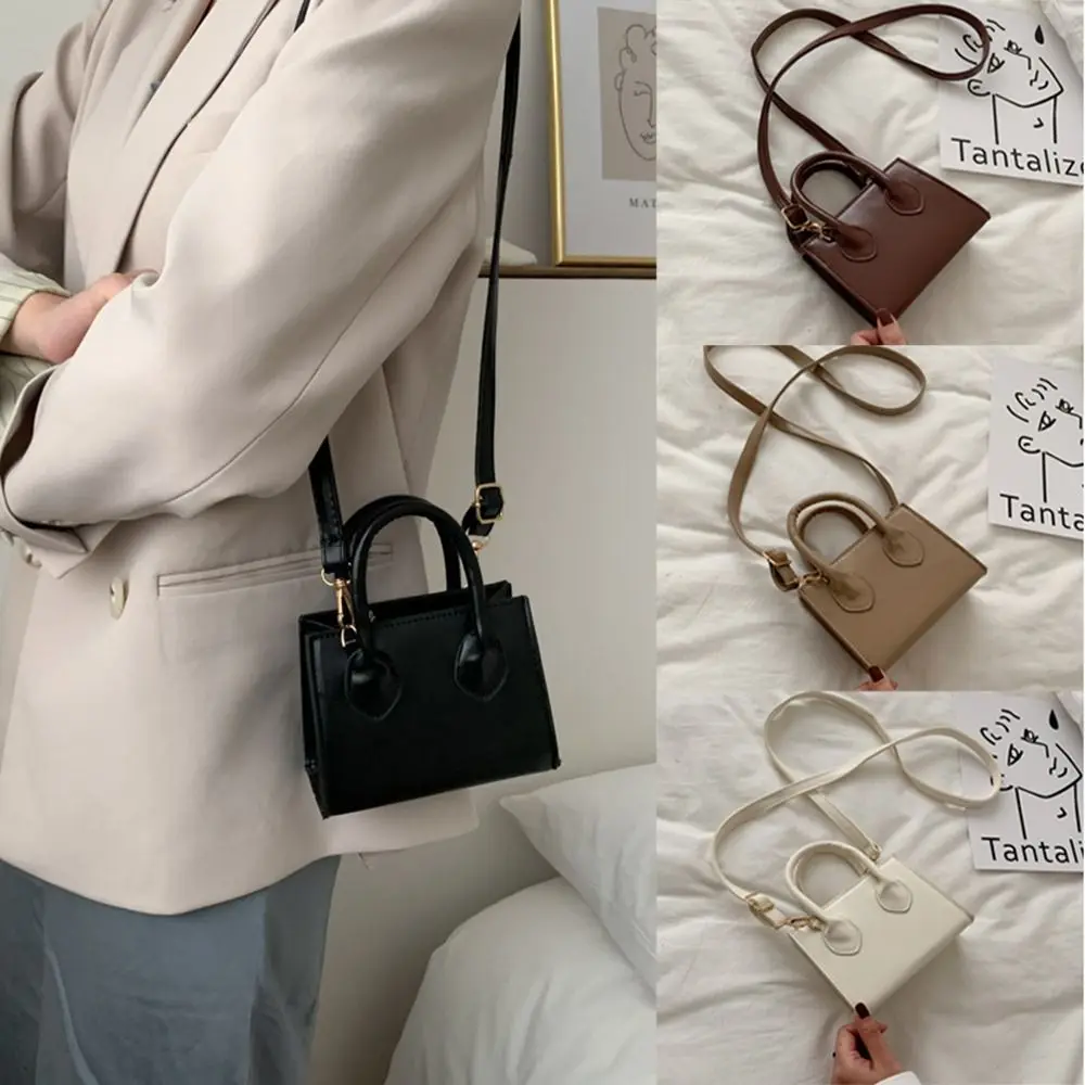 Маленькая квадратная сумка из искусственной кожи, однотонная минималистичная женская сумка через плечо с верхней ручкой, портативная сумка на плечо с клапаном, кошелек на плечо
Маленькая квадратная сумка из искусственной кожи, однотонная минималистичная женская сумка через плечо с верхней ручкой, портативная сумка на плечо с клапаном, кошелек на плечо