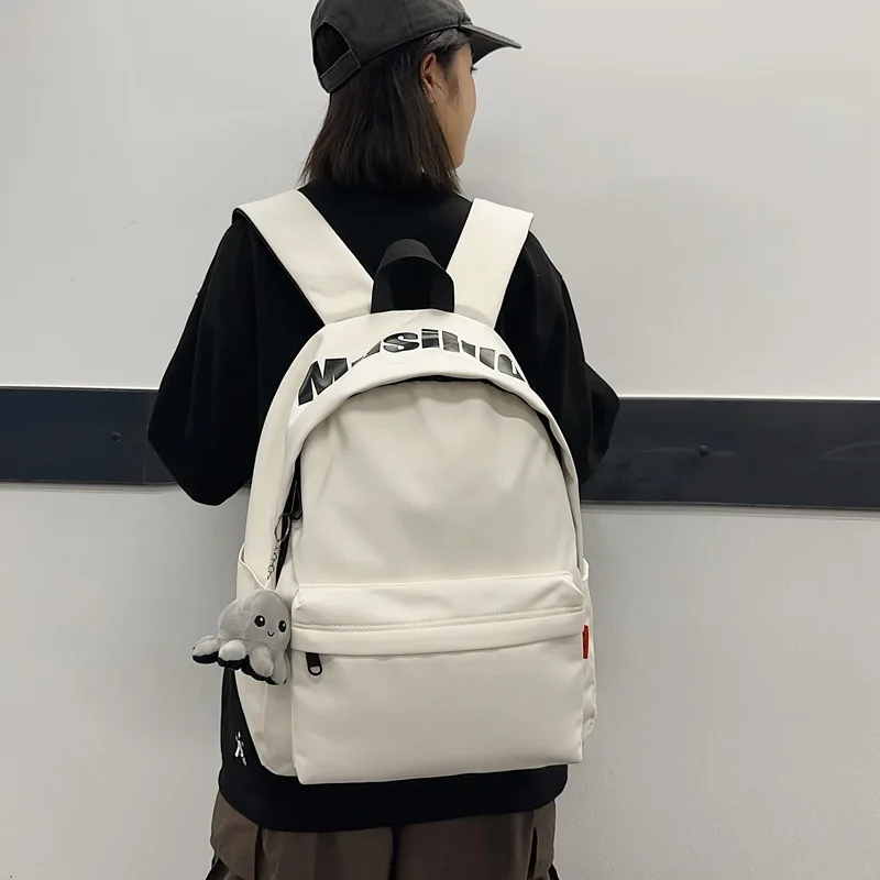 Minimalist White Backpack For Men Women Durable Casual Rucksack With Letter Print & Octopus Charm Detail
Minimalist White Backpack For Men Women Durable Casual Rucksack With Letter Print & Octopus Charm Detail