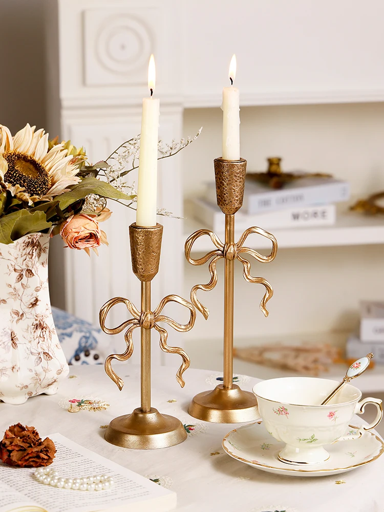 French candle candle holder ornament bow gold high-end light luxury photo background romantic candlelight
French candle candle holder ornament bow gold high-end light luxury photo background romantic candlelight