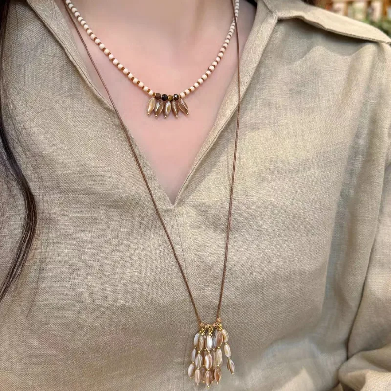 Natural Oxford Shell Pendant, Fringed Necklace, High-end Design, Double-layer Stacked Collarbone Chain, Beaded Sweater Chain Acc
Natural Oxford Shell Pendant, Fringed Necklace, High-end Design, Double-layer Stacked Collarbone Chain, Beaded Sweater Chain Acc