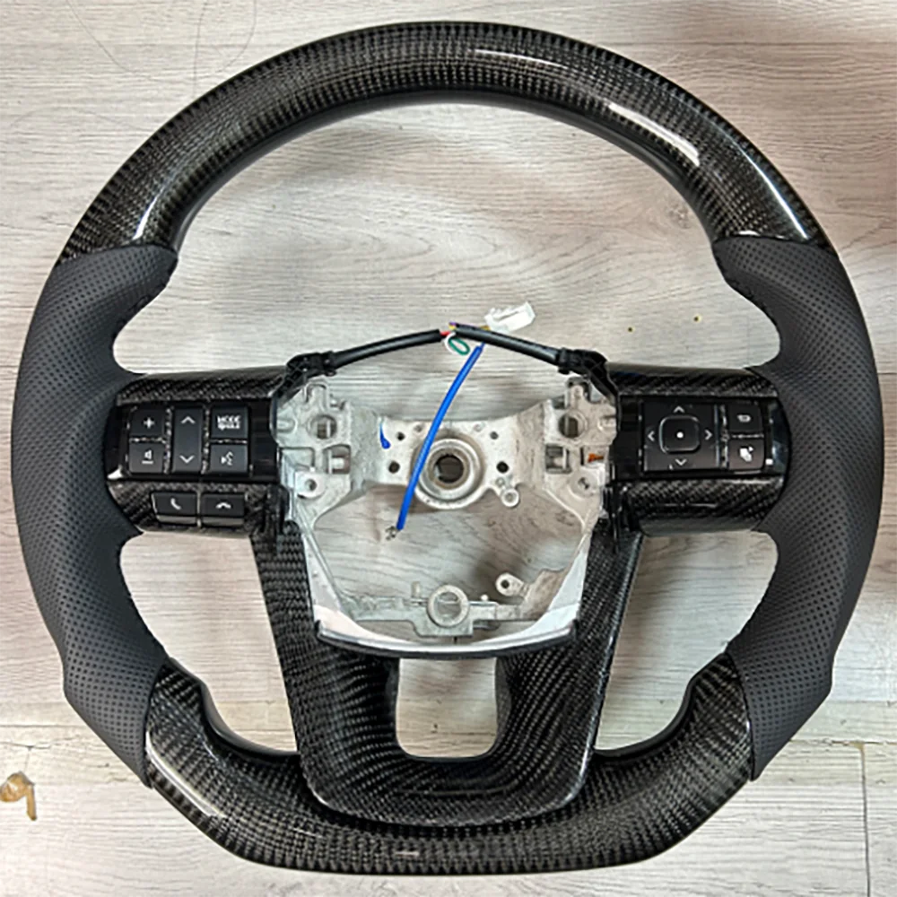 For Toyota Hyrax Carbon Fiber Perforated Leather Black Stitching With Key Button Steering Wheel Aseembly
For Toyota Hyrax Carbon Fiber Perforated Leather Black Stitching With Key Button Steering Wheel Aseembly
