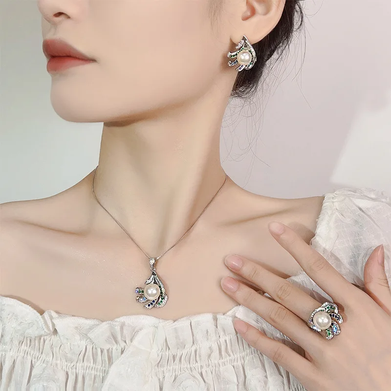 New style pearl earrings, necklace and ring set for women, with a high-end and fashionable feel.
New style pearl earrings, necklace and ring set for women, with a high-end and fashionable feel.