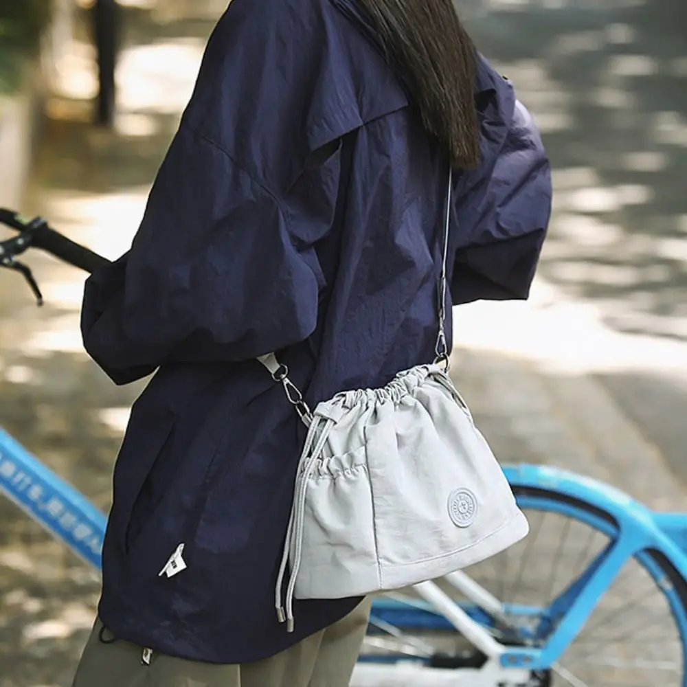 Korean Style Drawstring Bucket Bag Purse Handbag Nylon Shoulder Bag Mobile Phone Bag Solid Color Oxford Cloth Crossbody Bag
Korean Style Drawstring Bucket Bag Purse Handbag Nylon Shoulder Bag Mobile Phone Bag Solid Color Oxford Cloth Crossbody Bag