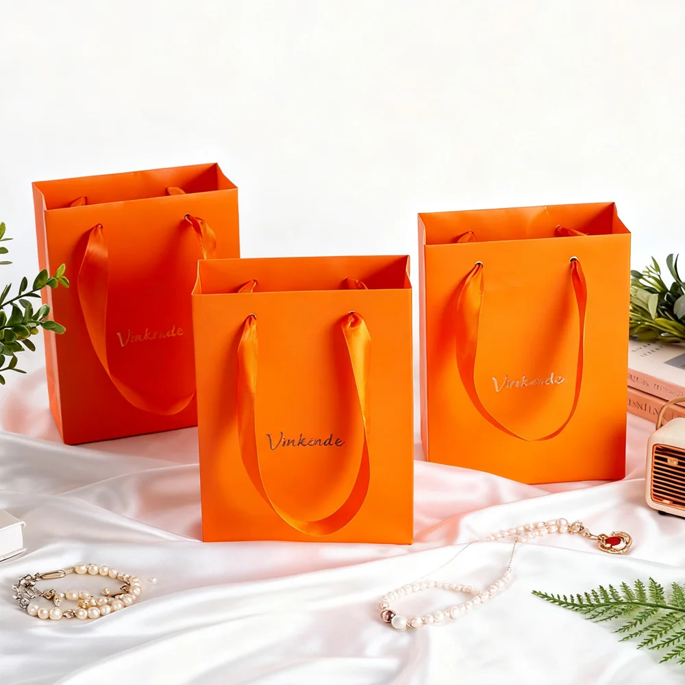 50 упаковок с логотипом на заказ 12x5,7x16 см, роскошные оранжевые бумажные сумки для покупок, креативный свадебный подарок, персонализированный уход за кожей, губная помада, пылесборник
50 упаковок с логотипом на заказ 12x5,7x16 см, роскошные оранжевые бумажные сумки для покупок, креативный свадебный подарок, персонализированный уход за кожей, губная помада, пылесборник