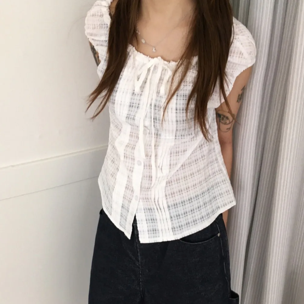 Korean Style Chic Plaid Short Sleeve Single Button Women's Shirt Drawstring Design Versatile Top Gathered Hem Bubble Sleeve
Korean Style Chic Plaid Short Sleeve Single Button Women's Shirt Drawstring Design Versatile Top Gathered Hem Bubble Sleeve