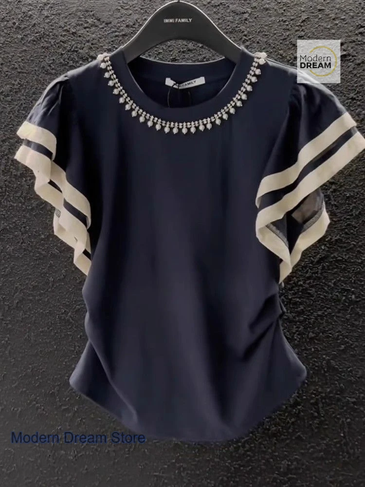 French round neck solid color short-sleeved T-shirt female summer new fashion contrast stitching flying sleeve waist beaded top.
French round neck solid color short-sleeved T-shirt female summer new fashion contrast stitching flying sleeve waist beaded top.