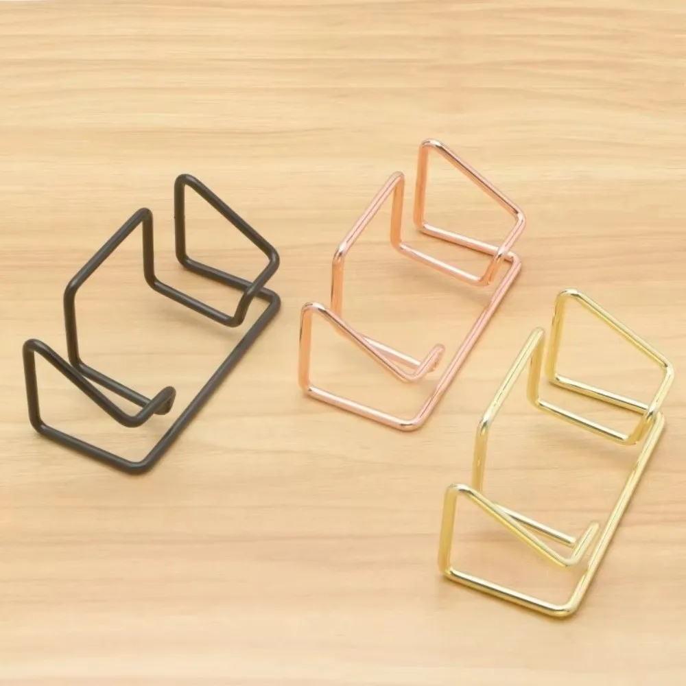 Новый металлический держатель для визитных карточек, элегантный стеллаж для карточек с несколькими сценками, минималистичный держатель для карточек, офисное использование
Новый металлический держатель для визитных карточек, элегантный стеллаж для карточек с несколькими сценками, минималистичный держатель для карточек, офисное использование