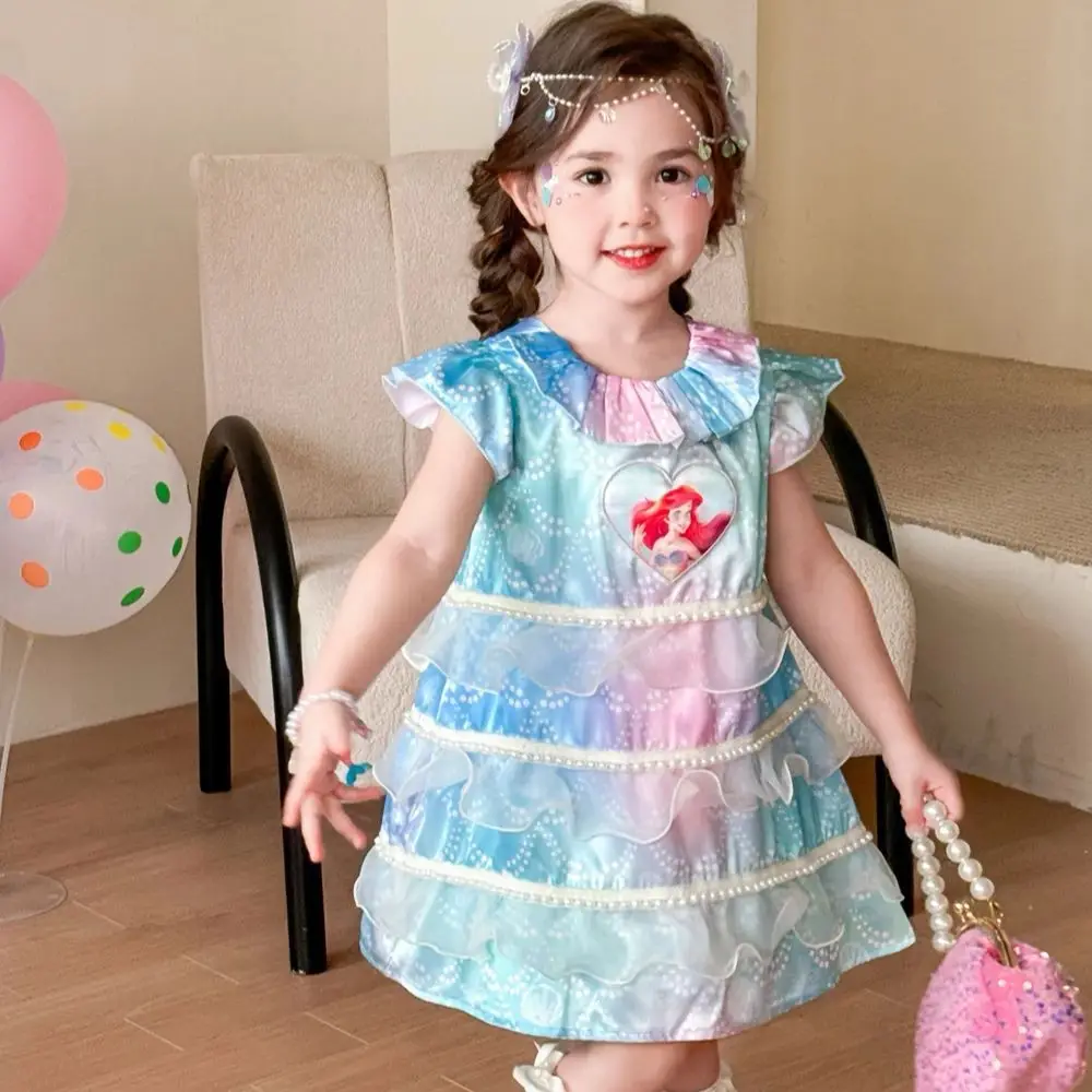 Синее тюлевое платье принцессы-русалки Диснея, детское платье трапециевидной формы с рюшами без рукавов, милое повседневное летнее платье с героями мультфильмов для девочек, детские платья
Синее тюлевое платье принцессы-русалки Диснея, детское платье трапециевидной формы с рюшами без рукавов, милое повседневное летнее платье с героями мультфильмов для девочек, детские платья