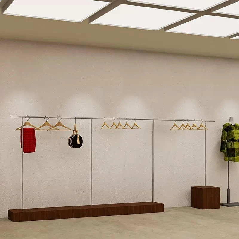 Clothing store display rack on wall walnut color hanger stainless steel
Clothing store display rack on wall walnut color hanger stainless steel