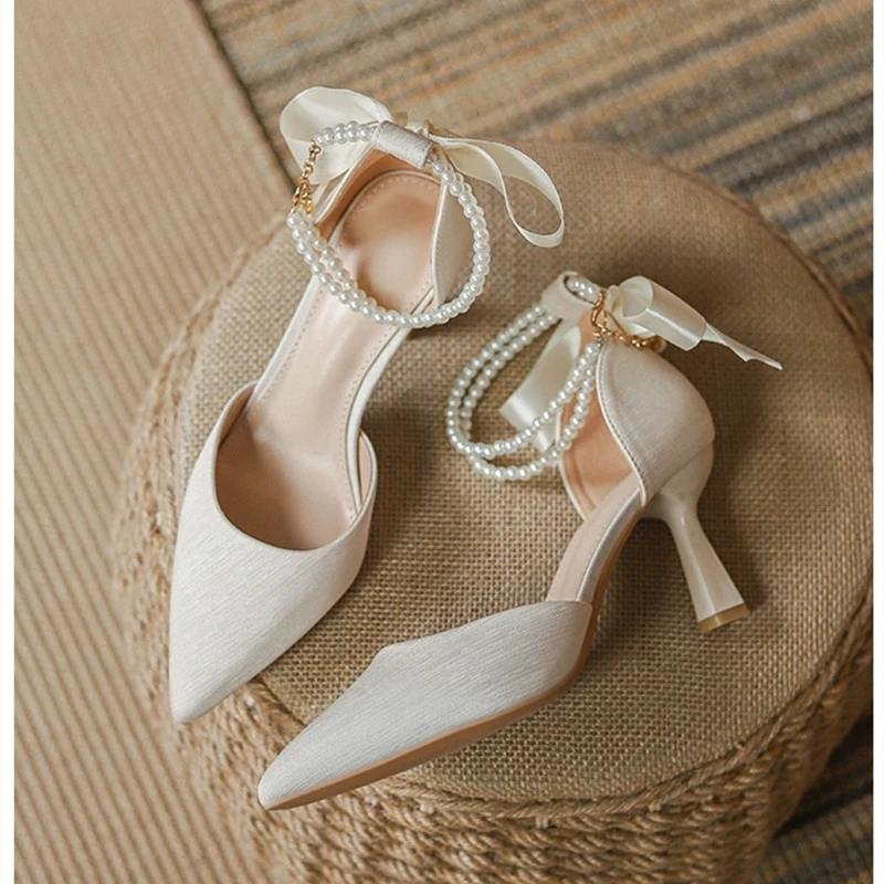 2025 New Wedding Heels Women Luxury Brand Design String Bead Pearls High Heels Ladies Sexy Elegant Pointed Toe White Black Pumps
2025 New Wedding Heels Women Luxury Brand Design String Bead Pearls High Heels Ladies Sexy Elegant Pointed Toe White Black Pumps