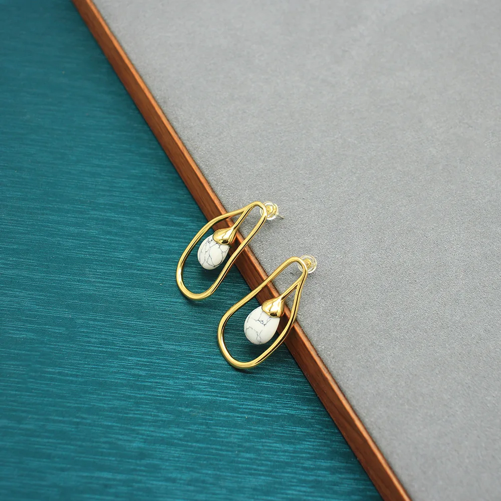 Minimalist Geometric White Turquoise Teardrop Earrings with Gold Accents - Subtle Luxury Studs
Minimalist Geometric White Turquoise Teardrop Earrings with Gold Accents - Subtle Luxury Studs