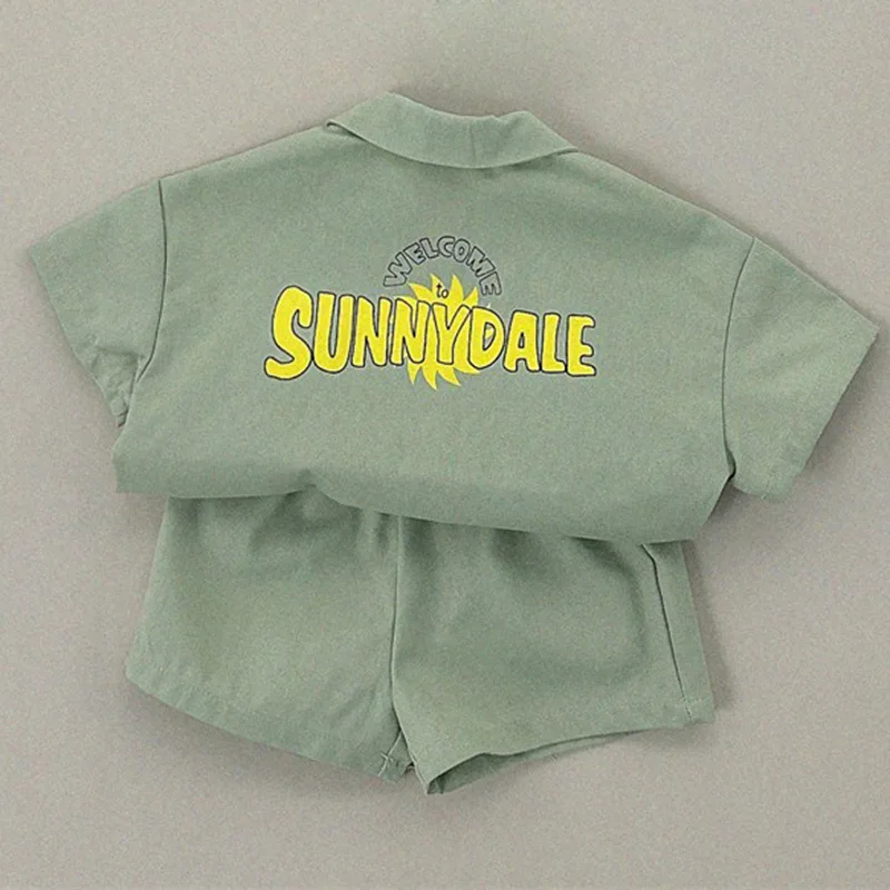 2026 Summer New Children Short Sleeve Clothes Set Boys Girls Letter Print Lapel Shirts + Shorts 2pcs Suit Kids Casual Outfits
2026 Summer New Children Short Sleeve Clothes Set Boys Girls Letter Print Lapel Shirts + Shorts 2pcs Suit Kids Casual Outfits