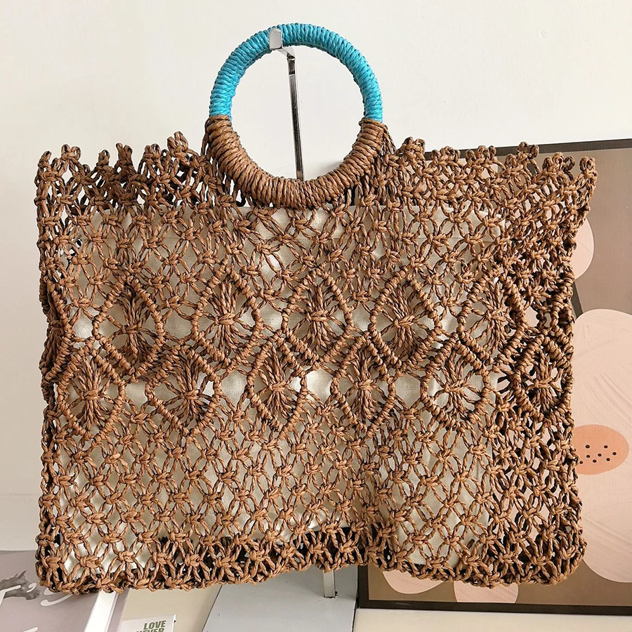 Summer New brown thread woven purse handbag hollow out design straw clutch bag for women beach vacation round handle totes bolsa
Summer New brown thread woven purse handbag hollow out design straw clutch bag for women beach vacation round handle totes bolsa