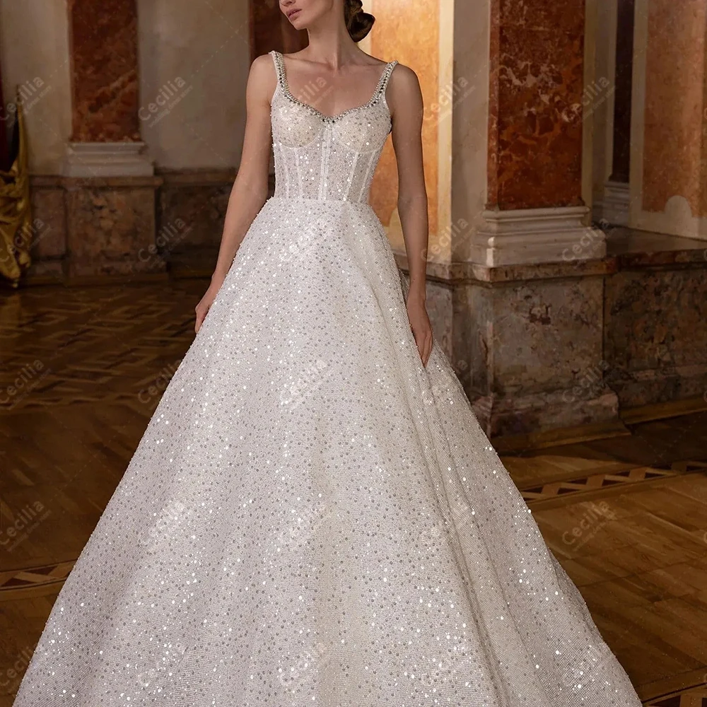 Glitter Wedding Dresses Modern Bridal Gowns Lace Tiered Robes Sexy Sleeveless Backless Tulle Customized Vestidos De Novia 2025
Glitter Wedding Dresses Modern Bridal Gowns Lace Tiered Robes Sexy Sleeveless Backless Tulle Customized Vestidos De Novia 2025