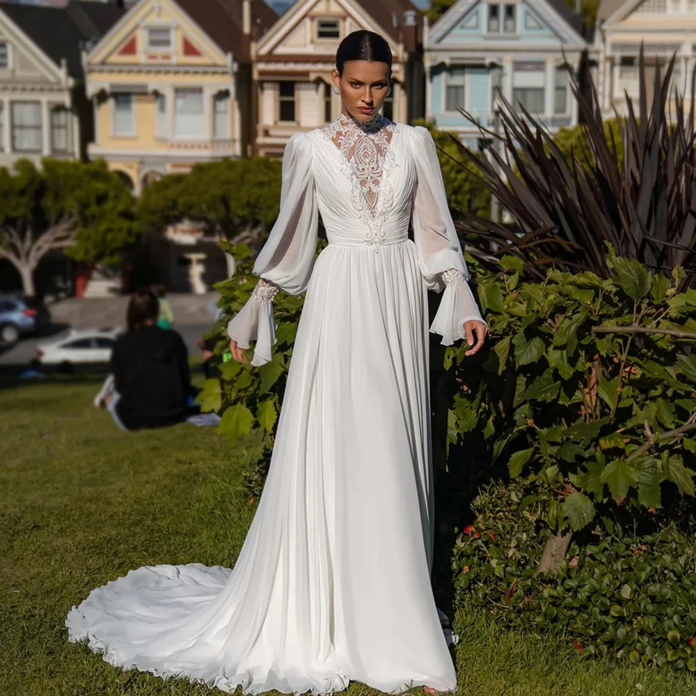 High Neck Applique Chiffon Wedding Dress Long Flare Sleeve Pleat A-Line Vintage Floor Length with Button Bride Robe De Mariée
High Neck Applique Chiffon Wedding Dress Long Flare Sleeve Pleat A-Line Vintage Floor Length with Button Bride Robe De Mariée
