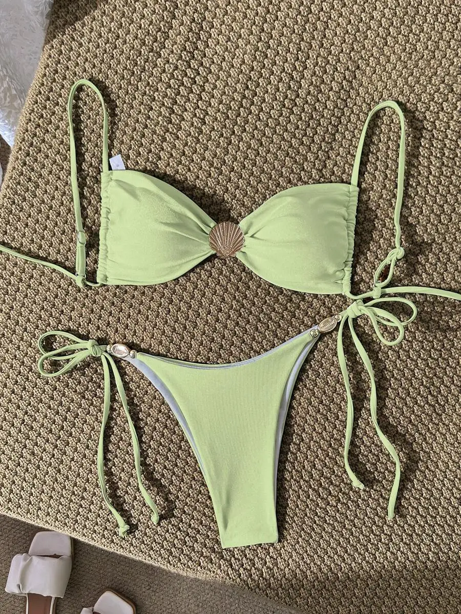 Mint Green Wireless Bikini Set Featuring Shell Embellishment, Adjustable Spaghetti Straps And Side-Tie Thong Bottom
Mint Green Wireless Bikini Set Featuring Shell Embellishment, Adjustable Spaghetti Straps And Side-Tie Thong Bottom