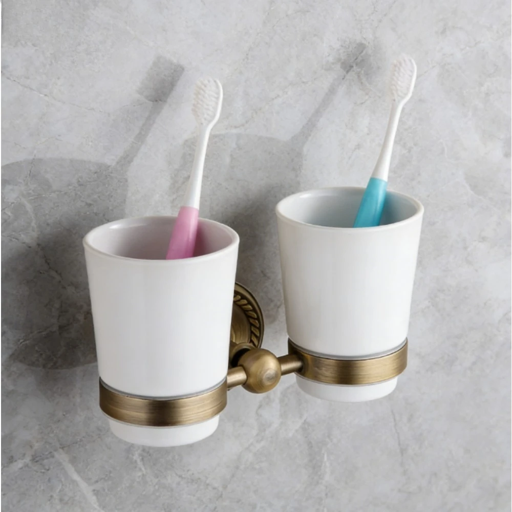 Держатель для зубных щеток с двойной чашкой для ванной комнаты, античный латунный материал, настенные аксессуары для мытья в стиле ретро
Держатель для зубных щеток с двойной чашкой для ванной комнаты, античный латунный материал, настенные аксессуары для мытья в стиле ретро