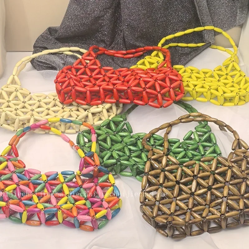 Ins Полая ручная тканая женская сумка в форме клецок, сумки с деревянными бусинами, нишевый дизайн, готовая женская сумка ручной работы подмышками
Ins Полая ручная тканая женская сумка в форме клецок, сумки с деревянными бусинами, нишевый дизайн, готовая женская сумка ручной работы подмышками