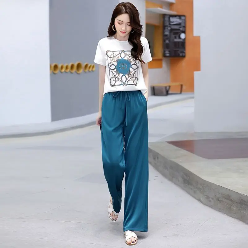 Women Suit 2024 Summer New Korean Style Short Sleeve Tops Fashion Wide Leg Pants 2 Two Piece Set Casual Plus Size Female Outfits
Women Suit 2024 Summer New Korean Style Short Sleeve Tops Fashion Wide Leg Pants 2 Two Piece Set Casual Plus Size Female Outfits