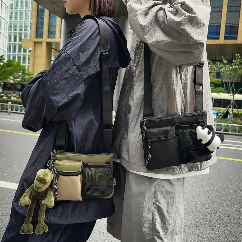 Japanese tooling wind messenger bag contrasting color street tide brand small square bag light commuter mobile phone bag shoulde
Japanese tooling wind messenger bag contrasting color street tide brand small square bag light commuter mobile phone bag shoulde