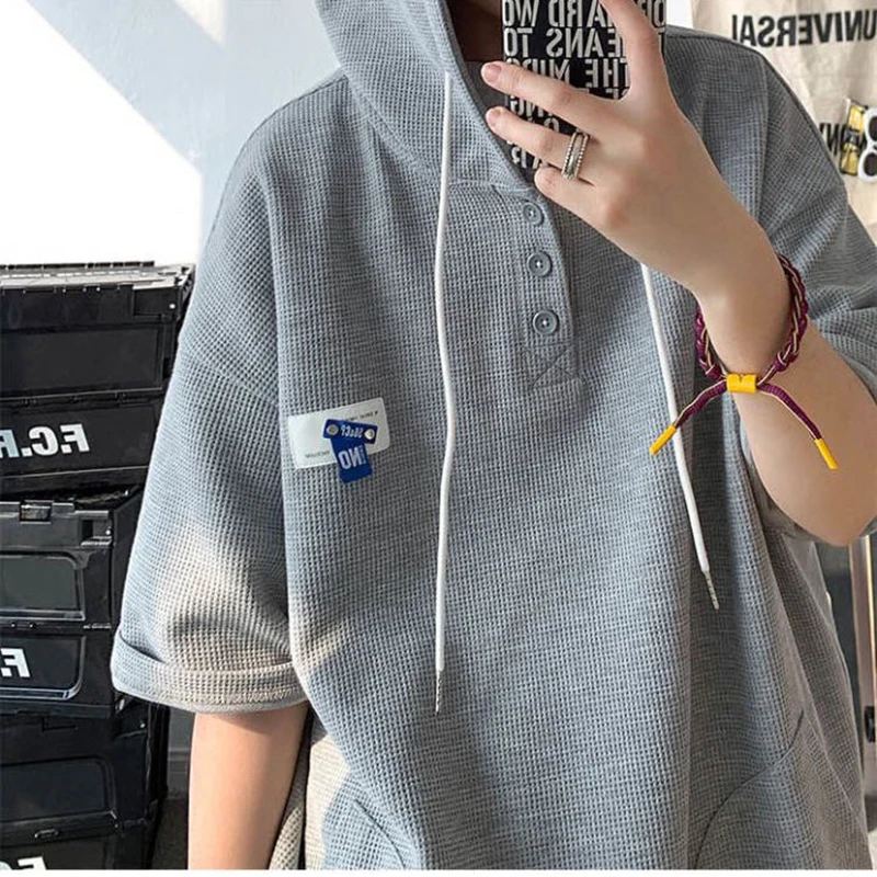 Men Waffle Knit Hooded Short Sleeve T-shirt Summer Thin Oversized Hongkong Streetwear Ins Cool Guy Half Button Hoodie Top
Men Waffle Knit Hooded Short Sleeve T-shirt Summer Thin Oversized Hongkong Streetwear Ins Cool Guy Half Button Hoodie Top