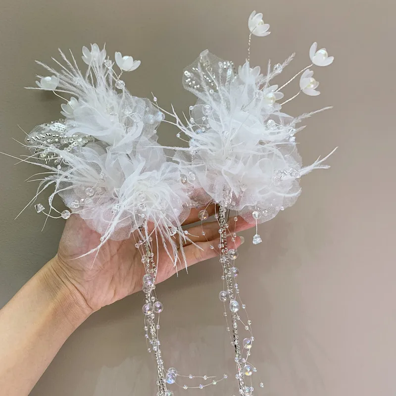 Pair of Elegant Feather Hair Decorations with Crystal Beads, Perfect for Weddings and Special Occasions
Pair of Elegant Feather Hair Decorations with Crystal Beads, Perfect for Weddings and Special Occasions